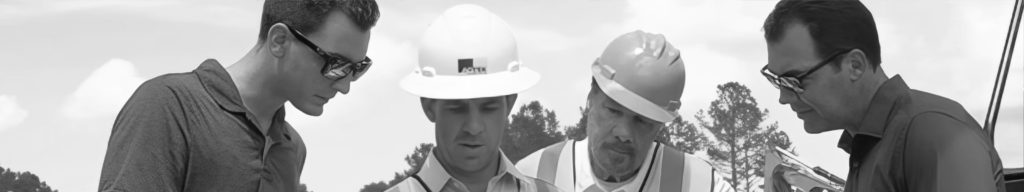 Workers looking over construction data