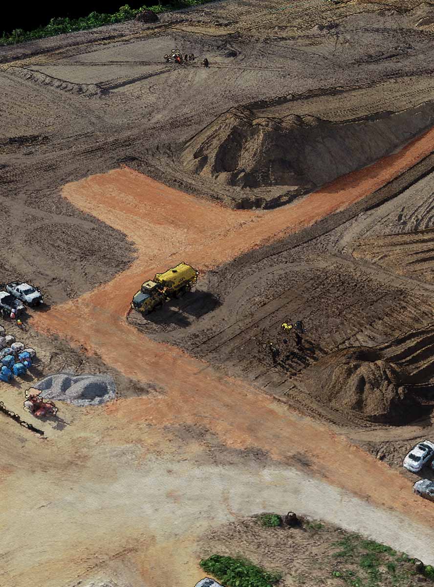 dirt construction site with vehicles